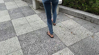 Public Wetting Jeans in Park Near the Beach