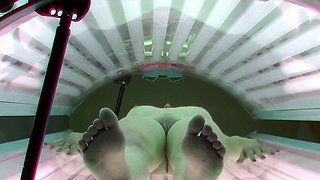 Young redhead in solarium