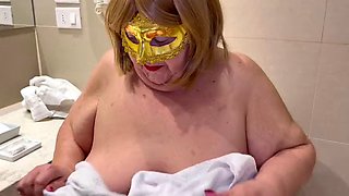 Hot granny playing with wet t-shirts with the huge tits that this fat old woman has