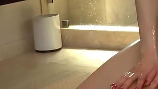 Beauty babe gives him amazing blowjob in bathroom