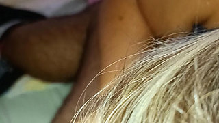 A young blonde jerks off a guy .he caresses her big breasts and her beautiful pink nipples