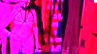 Dom Gresopio in Shibari Corset with Clothing and Mask