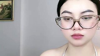 Beautiful Asian Woman Shows Off Cleavage