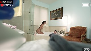 Natural tits and long hair brunette gets a bathroom handjob