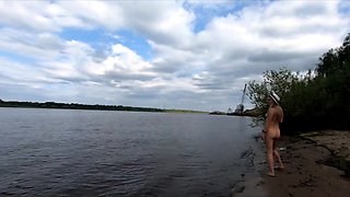 Exhibitionist Blonde Goes Nude on a River Beach