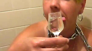 Chained slave girlfriend pissed on, having piss and then her own from shot glass