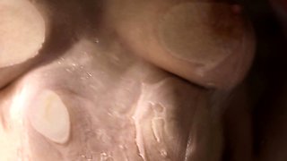Small titted brunette Sharron with glasses masturbates