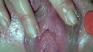Girl Plays with Her Spread Pussy and Pees