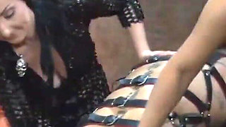 Caning by 2 mistresses