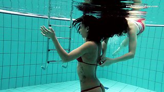 Hot tempered babe Nina Markova and her sexy GF are stripping under the water
