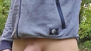 Slender man shows his big cock outdoors. Cum and piss in public