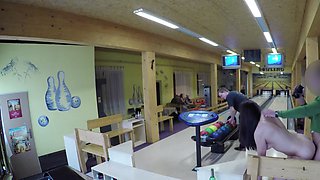 Guy is playing bowling while another man is fucking his chick