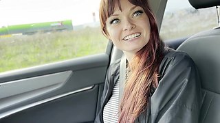 A Hitchhiker Plays with the Driver in the Front Seat