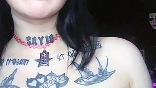 Sexy Alternative Brunette Drinking Sparkling Water and Burping