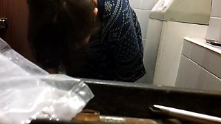 Big mature butt caught on a sitting on a toilet