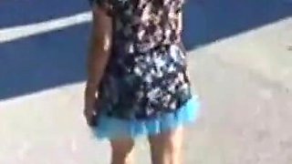Mel walking on the side of the road