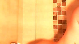 Hot babe with perfect big boobs taking shower
