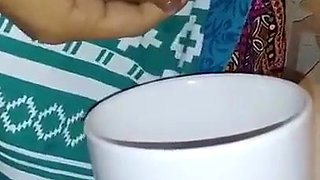 Hot Indian Wife squeezing milk into the glass