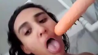 Horny brunette with natural tits having fun with a dildo