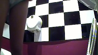 Lovely brunette stranger girl bends over and pisses in the toilet