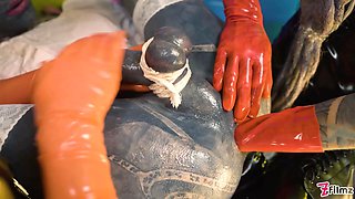 Two latex dominatrix sissy femdom anal fisting