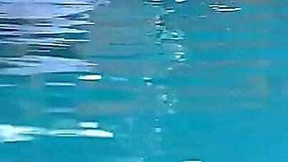 Couple Underwater Diving and Swimming