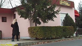 Beauty pissing on street behind bushes