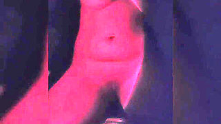 Naughty Brunette in the Dark Room Doing Stripetese