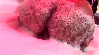 Eating brunette's big ass in the bathtub