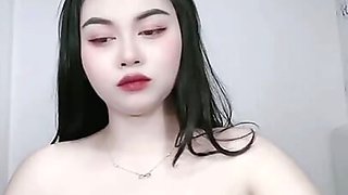 Beautiful Asian girl looks big tits.