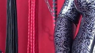 Latex Mistress Verbally Humiliates and Strapons Rubber Sissy Doll. Arya Grander