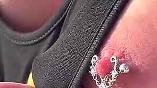 Boobs and Pierced Nipples Playing on the Beach