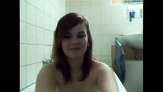 Webcam scene with gal teasing with her tits in the bathroom