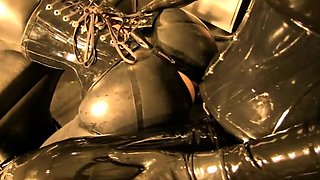 Gloved strapon fetish mistress