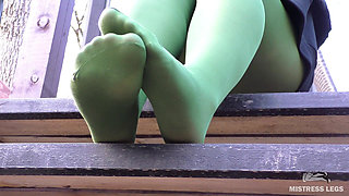 Goddess in Green Pantyhose Teases with Her Feet on the Porch