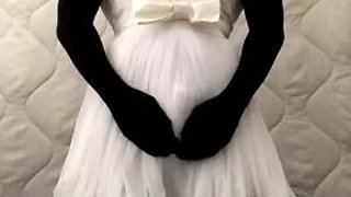 Black nylon doll with short white wedding dress