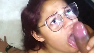 cheating wife in glasses gives a perfect deepthroat blowjob and receives a facial cumshot in her face and glasses