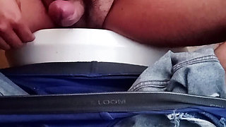 Shaking his penis in the work cellar.