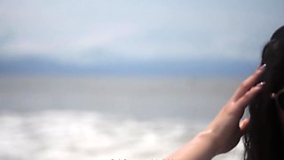 Sexy Latina MILF in bikini posing seductively on the beach
