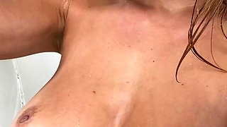 Hot babe with perfect big boobs taking shower