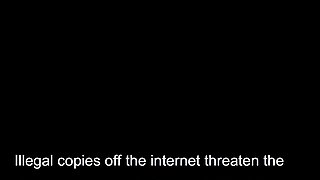 In a kitchen a sexy brunette playing with her big boobs