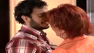Old woman kissing young man 1