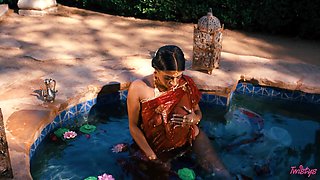 In the moonlit waters' embrace, Jasmine Sherni awakens sensual passions with graceful allure.