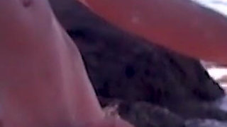Hot couple having sex on the beach