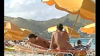 Beach voyeur video of a nude milf and a nude Asian hottie