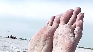 Milf seductress showing off her fabulous feet outdoors