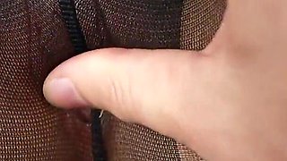 Close-up tight hole in torn pantyhose!