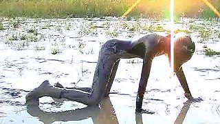 Outdoor solo masturbation scene with curly blonde