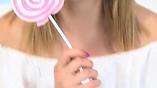 Marvelous blonde with perfect body touches her cunt with sweet candy