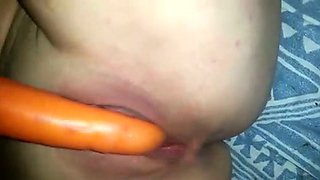 Pleasing my pussy and ass hole with vegetables